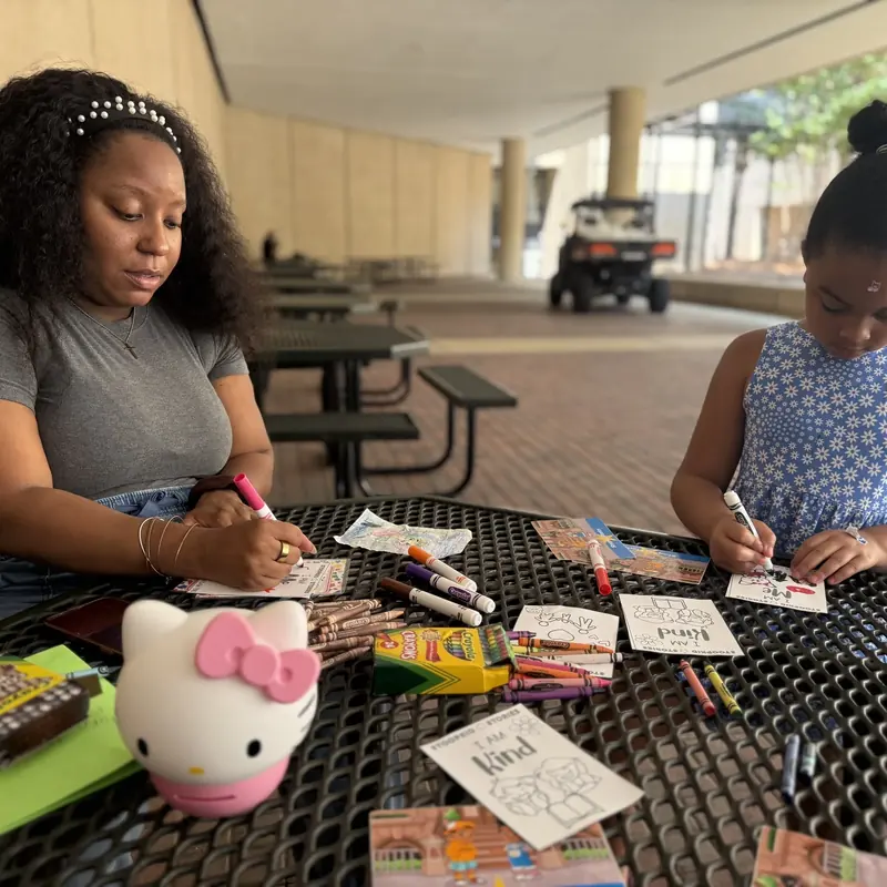 Kids drawing and crafting together at a Stoopkid Stories event